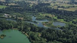 5K aerial stock footage approach the East Fork of the Lewis River in Ridgefield, Washington Aerial Stock Footage | AX52_083