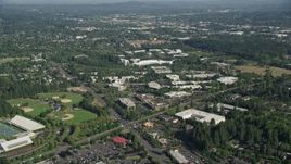 5K aerial stock footage of approaching Nike Headquarters among trees, Beaverton, Oregon Aerial Stock Footage | AX53_003