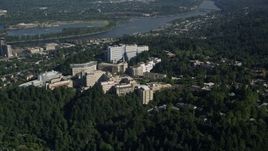 5K aerial stock footage of Oregon Health and Science University on a tree covered hill, Portland, Oregon Aerial Stock Footage | AX53_015