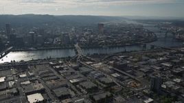 5K aerial stock footage of Downtown Portland cityscape seen from industrial area, Portland, Oregon Aerial Stock Footage | AX53_047