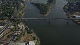 5K aerial stock footage of orbiting Ross Island Bridge revealing cityscape, Downtown Portland, Oregon Aerial Stock Footage | AX53_056E