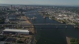5K aerial stock footage fly along Willamette River and Downtown Portland buildings, Portland, Oregon Aerial Stock Footage | AX53_072E