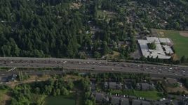 5K aerial stock footage fly by heavy highway traffic, a school and park, Southwest Portland, Oregon Aerial Stock Footage | AX53_092