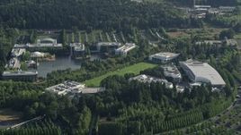 5K aerial stock footage fly by Nike Headquarters nestled among trees, Beaverton, Oregon Aerial Stock Footage | AX53_098