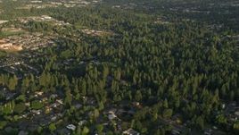 5K aerial stock footage approach and tilt to homes, Beaverton, Oregon, sunset Aerial Stock Footage | AX54_003