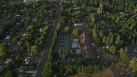 5K aerial stock footage of flying over a community sports center in Beaverton, Oregon, sunset Aerial Stock Footage | AX54_008