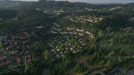 5K aerial stock footage of flying by hillside apartment building, Southwest Portland, Oregon, sunset Aerial Stock Footage | AX54_013