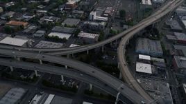 5K aerial stock footage tilt to bird's eye of Highway 30 and Interstate 405 interchange, Portland, Oregon, sunset Aerial Stock Footage | AX54_025