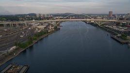 5K aerial stock footage fly over Willamette River, Fremont Bridge, pan to Downtown Portland, Oregon, sunset Aerial Stock Footage | AX54_028E