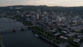 5K aerial stock footage of flying by downtown, Morrison Bridge, Downtown Portland, Oregon, sunset Aerial Stock Footage | AX54_031
