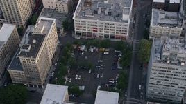 5K aerial stock footage of orbiting a parking lot and office buildings, Downtown Portland, Oregon, sunset Aerial Stock Footage | AX54_040