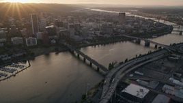 5K aerial stock footage follow Hawthorne Bridge, Willamette River, Downtown Portland, Oregon, sunset Aerial Stock Footage | AX54_057E