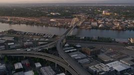 5K aerial stock footage of approaching Fremont Bridge and freeway interchange, Downtown Portland, Oregon, sunset Aerial Stock Footage | AX54_061