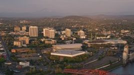 5K aerial stock footage of Rose Garden Arena, Memorial Coliseum, Downtown Portland, Oregon, sunset Aerial Stock Footage | AX54_064E