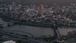 5K aerial stock footage of flying by downtown, from near Steel Bridge, Downtown Portland, Oregon, sunset Aerial Stock Footage | AX54_066