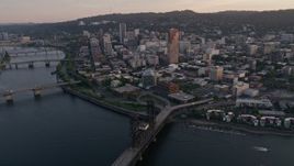 5K aerial stock footage fly by downtown, over Willamette River, Steel Bridge, Downtown Portland, Oregon, sunset Aerial Stock Footage | AX54_067