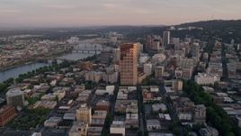 5K aerial stock footage of approaching US Bancorp Tower and bridges over the Willamette River, Downtown Portland, Oregon, sunset Aerial Stock Footage | AX54_068E