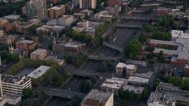 5K aerial stock footage of flying by Interstate 405, Downtown Portland, Oregon, sunset Aerial Stock Footage | AX54_078