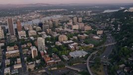 5K aerial stock footage of flying by skyscrapers and Portland State University in Downtown Portland, Oregon, sunset Aerial Stock Footage | AX54_079