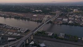 5K aerial stock footage of orbiting the top of the Fremont Bridge, Downtown Portland, Oregon, sunset Aerial Stock Footage | AX54_083E