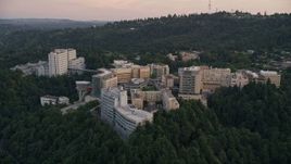 5K aerial stock footage of flying away from Oregon Health and Science University, Portland, Oregon, twilight Aerial Stock Footage | AX54_093