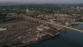 5K aerial stock footage pan across the Fremont Bridge, revealing Downtown Portland, Oregon, twilight Aerial Stock Footage | AX54_101E