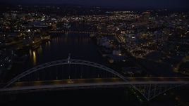5K aerial stock footage of orbiting the Fremont Bridge, revealing Downtown Portland, Oregon, twilight Aerial Stock Footage | AX55_007E