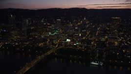 5K aerial stock footage fly by buildings in downtown, Morrison and Hawthorne Bridges, Downtown Portland, Oregon, twilight Aerial Stock Footage | AX55_011E