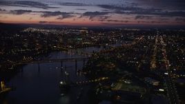 5K aerial stock footage of downtown and the Willamette River at twilight, seen from Ross Island Bridge, Downtown Portland, Oregon Aerial Stock Footage | AX55_013