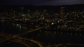 5K aerial stock footage of following Burnside Street Bridge, approaching Downtown Portland, Oregon, night Aerial Stock Footage | AX55_038E