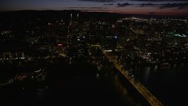 5K aerial stock footage of flying over buildings near Wells Fargo Center, Portland, Oregon, night Aerial Stock Footage | AX55_045E