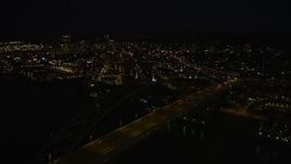 5K aerial stock footage of orbiting Fremont Bridge to reveal Downtown Portland, Oregon, night Aerial Stock Footage | AX55_051