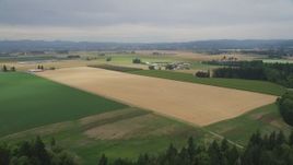 5K aerial stock footage approach and fly over trees, crop fields and farms in Hillsboro, Oregon Aerial Stock Footage | AX56_001