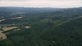 5K aerial stock footage approach small farms beside evergreen forest in Washington County, Oregon Aerial Stock Footage | AX56_016