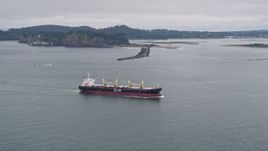 5K aerial stock footage track oil tanker on the Columbia River near Cape Disappointment, Washington Aerial Stock Footage | AX56_085
