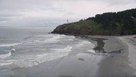 5K aerial stock footage approach and track the North Head Light on top of an oceanside cliff, Ilwaco, Washington Aerial Stock Footage | AX56_106E
