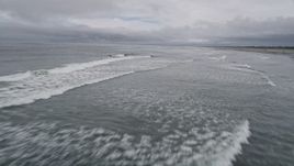 5K aerial stock footage of crashing waves near a beach in Seaview, Washington Aerial Stock Footage | AX56_129