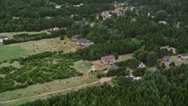 5K aerial stock footage approach rural homes and trees in Oceanside, Washington Aerial Stock Footage | AX56_145