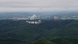 5K aerial stock footage of Satsop Nuclear Power Plant cooling towers surrounded by forest, Satsop, Washington Aerial Stock Footage | AX57_007E