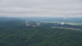 5K aerial stock footage of flying by the Satsop Nuclear Power Plant, Satsop, Washington Aerial Stock Footage | AX57_011