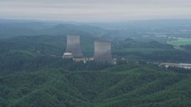 5K aerial stock footage of a pair of cooling towers at the Satsop Nuclear Power Plant, Satsop, Washington Aerial Stock Footage | AX57_012