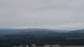 5K aerial stock footage track a skydiver landing at Sanderson Field airport, Shelton, Washington Aerial Stock Footage | AX57_038
