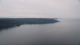 5K aerial stock footage fly away from Vashon Island, seen from Puget Sound, Washington Aerial Stock Footage | AX58_065