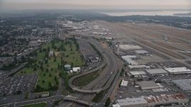 5K aerial stock footage of light traffic on Airport Expressway by Seattle Tacoma International Airport, Seattle, Washington Aerial Stock Footage | AX58_073