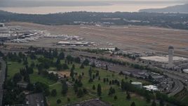 5K aerial stock footage of runways and control tower at Seattle Tacoma International Airport, Seattle, Washington Aerial Stock Footage | AX58_074
