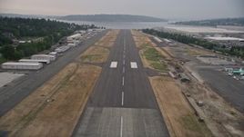 5K aerial stock footage fly over the runway and landing at Renton Municipal Airport, Renton, Washington Aerial Stock Footage | AX58_082E