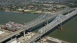 5K aerial stock footage of Crescent City Connection Bridge spanning the Mississippi River, New Orleans, Louisiana Aerial Stock Footage | AX59_009