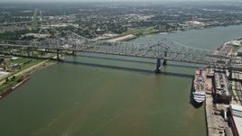5K aerial stock footage track light traffic crossing the Crescent City Connection Bridge, New Orleans, Louisiana Aerial Stock Footage | AX59_025