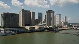 5K aerial stock footage of Hilton New Orleans and World Trade Center seen from the Mississippi River, Downtown New Orleans, Louisiana  Aerial Stock Footage | AX59_044