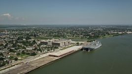 5K aerial stock footage of two military transport ships docked at Bywater, New Orleans, Louisiana Aerial Stock Footage | AX59_046
